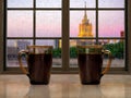 Two mugs with a hot drink - tea or coffee on the window sill of the window. During the early morning, the city, the rain. Concept Royalty Free Stock Photo
