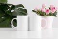 Two mugs mockup with pink roses in a pot and a monstera plant