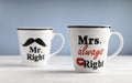 Two mugs with printed text Mr. right and Mrs. always right. Funny phrase about couples life printed on mugs Royalty Free Stock Photo