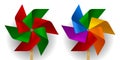 Two multi colored toy paper windmills with six blades