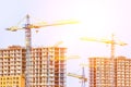 Two multi-storey buildings under construction. Many cranes. Construction of modern housing. Building bussiness. Royalty Free Stock Photo