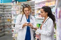 Two pharmacists working together at pharmacy