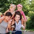 Two mums with their kids Royalty Free Stock Photo