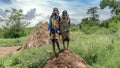 Two Mursi tribe girls from Ethiopia. The women of the Mursi tribe have a lip plate and iron decorations