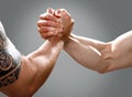 Two musculine male hands making an agreement