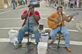 Two musicians perform in street of French Quarter near Bourbon Street in New Orleans, Louisiana Royalty Free Stock Photo