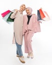 muslim bestfriend happy holding a shopping bag over white background