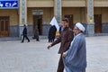 Two Muslim theologians go through courtyard of mosque, Shiraz, I