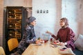 Two Muslim women in cafe, friends meeting Royalty Free Stock Photo