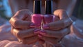 Photorealistic image of a nail polish held in hands Royalty Free Stock Photo