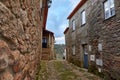 two narrow stone streets in an old european country village with stairs leading to the door Royalty Free Stock Photo