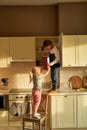 Two naughty kids, brother and sister found cookies box in the kitchen cabinet