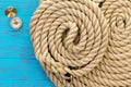 Two neatly coiled ropes and a magnetic compass