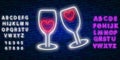 Two neon glasses with hearts. Glowing neon sign of champagne. Night illuminated brick wall. Champagne glasses clang