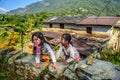 Two nepalese girls play in the garden of their home