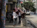 Two Nepali Men Carry on Shoulder Carpet Rug at Thamel Street
