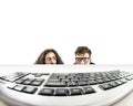 Two nerds staring at a keyboard