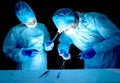 Two neurosurgeon doctors, a woman and a man perform a complex surgical operation. Concept of the category of complexity