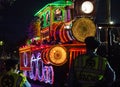 Police Officers Silhouetted by An Elaborate Train Float in the Orpheus Parade