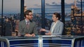 Two newsreaders discussing news evening stage tv studio closeup. Couple talking Royalty Free Stock Photo