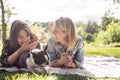 Two friends woman with terrier dog outside at the park Royalty Free Stock Photo