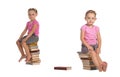 Two nice little girls sitting on stack of books Royalty Free Stock Photo