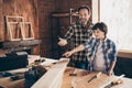 Two nice person cheerful cheery woodworkers handymen learning teaching creating construction at school course class Royalty Free Stock Photo