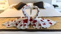 Two nice towel swans on a hotel`s bed Royalty Free Stock Photo