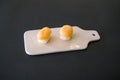 Two Nigiri Sushi with scallop served on beige board. Royalty Free Stock Photo