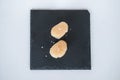 Two Nigiri Sushi with scallop served on black tray. Royalty Free Stock Photo