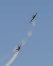 Two North American Aviation T-6 flying over Duck Creek with other Warbirds prior to the traditional fireworks display.