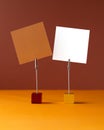 Two note holders with clip and blank card on orange background. Mockup writing messages. Royalty Free Stock Photo