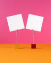 Two note holders with clip and blank card on pink background. Mockup writing messages. Royalty Free Stock Photo