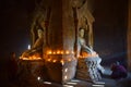 Two Novice light candle and pray in bagan pagoda in Myanmar. Royalty Free Stock Photo