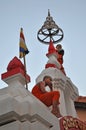 Two novices sitting on a temple gate in Vientiane