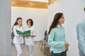 Two nurses discussing medical document in corridor Royalty Free Stock Photo