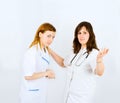 Two nurses handshake
