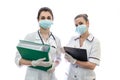 Two nurses holding documents isolated on white Royalty Free Stock Photo