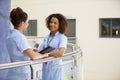 Two Nurses Meeting In Hospital Holding Digital Tablet Royalty Free Stock Photo