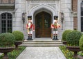 Two Nutcrackers guarding the door of a mansion in Highland Park at Christmas in Dallas County, Texas