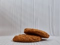 Two oatmeal cookies are on the table. Sweets. Royalty Free Stock Photo