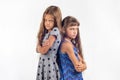 Two offended girls stand with their backs to each other Royalty Free Stock Photo