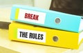 Two office folders with text BREAK THE RULES