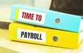 Two office folders with text TIME TO PAYROLL Royalty Free Stock Photo
