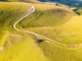 Two offroad cars parked on the mountain cliff in sunset near Travnik city in Bosnia and Herzegovina