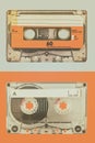 Two old audio compact cassettes on a blue with orange background Royalty Free Stock Photo