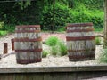 Two old barrels on a wooden barn floor