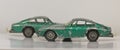 Two old battered small green metal toy cars Royalty Free Stock Photo