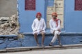 Two old bedouin man sitting on the street in city of Pushkar, Rajasthan, India Royalty Free Stock Photo