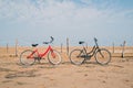 two old bikes at the beach in front of the sea Royalty Free Stock Photo